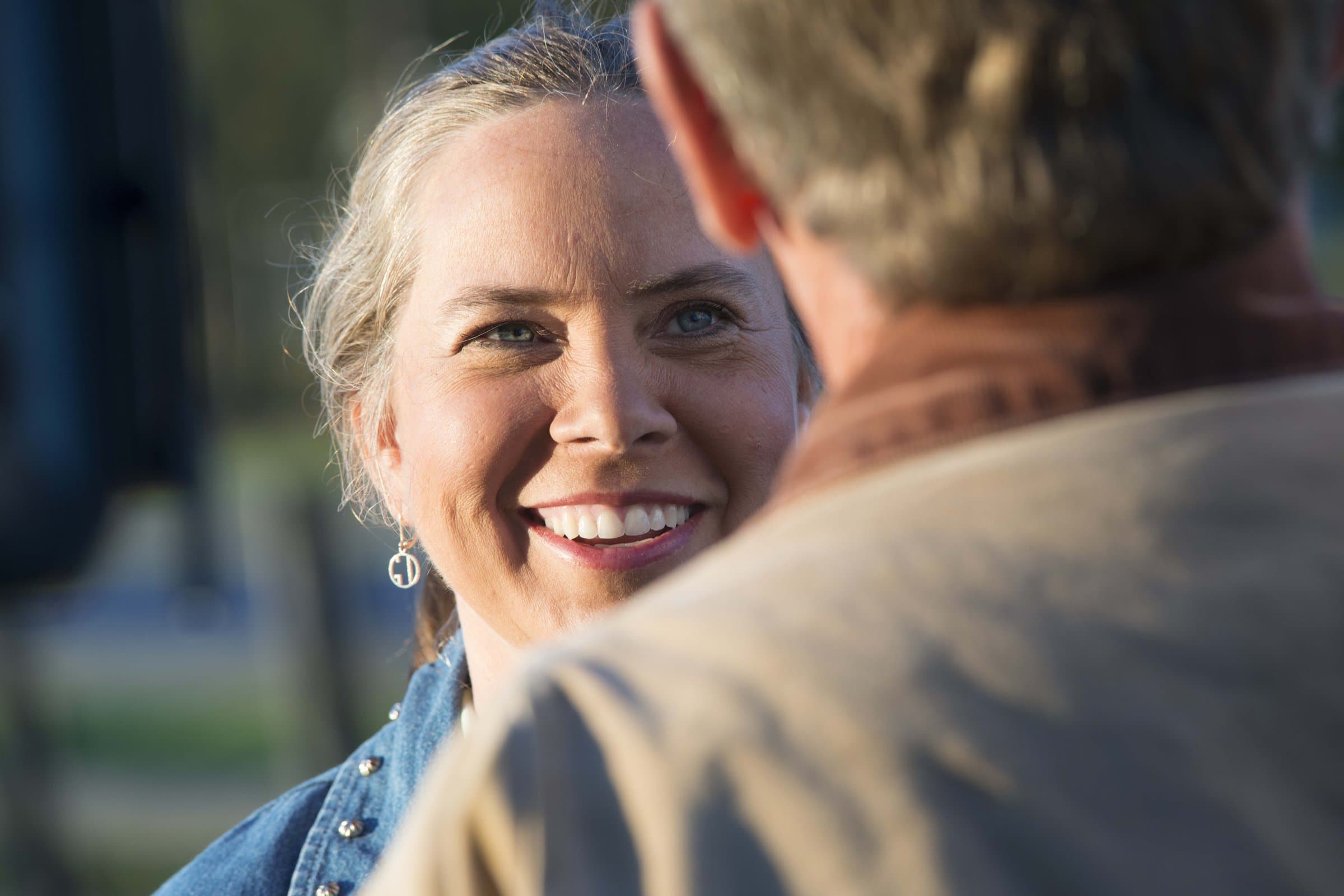 Suzanne Miles connecting with a constituent outdoors