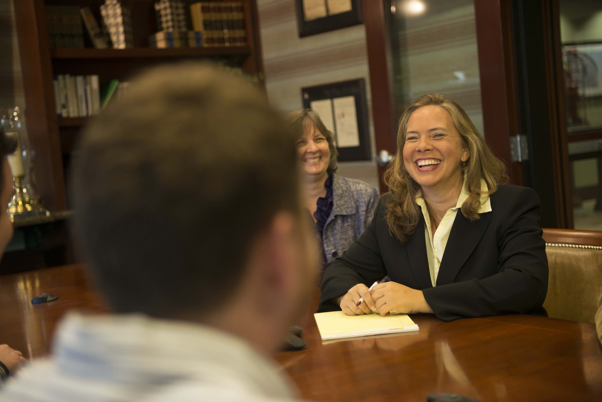 Suzanne Miles in a candid working meeting